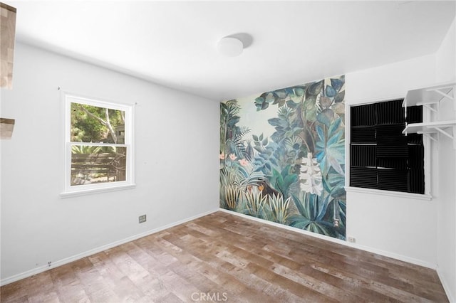 unfurnished room featuring wood-type flooring