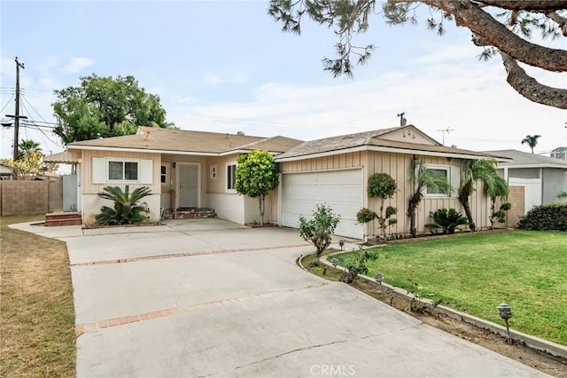 ranch-style house featuring a garage and a front yard