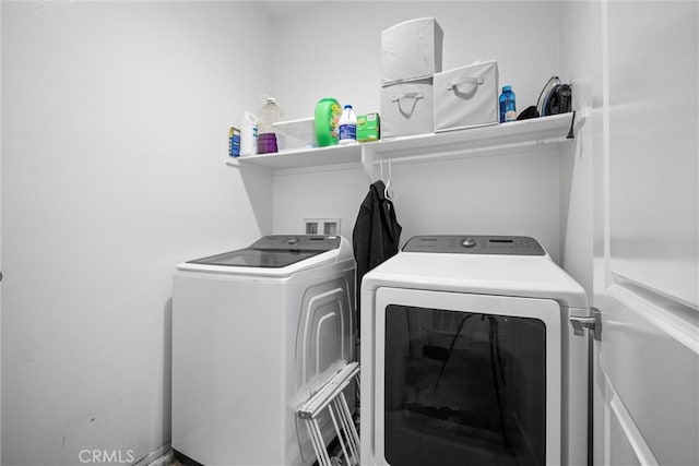 laundry room with washing machine and clothes dryer