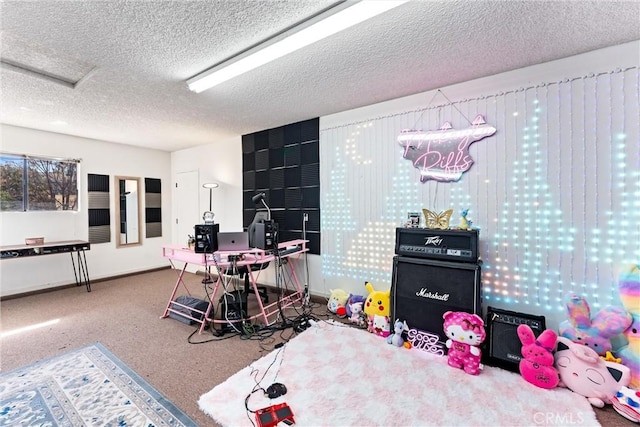 playroom with a textured ceiling