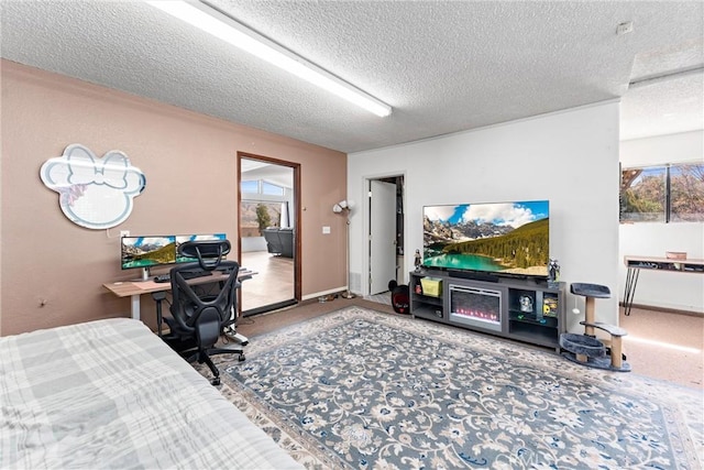 carpeted bedroom featuring multiple windows and a textured ceiling