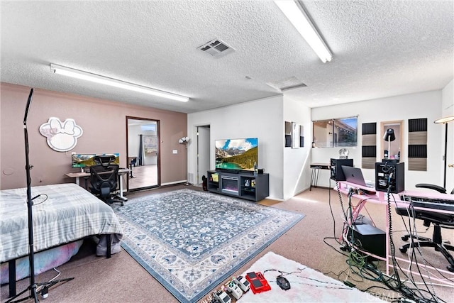 bedroom with a textured ceiling and carpet