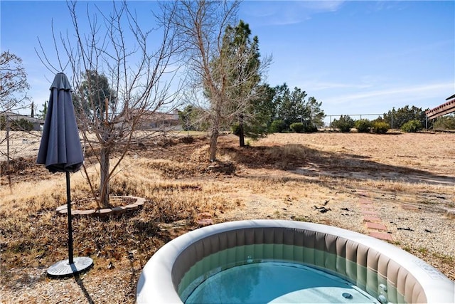 view of yard with a jacuzzi