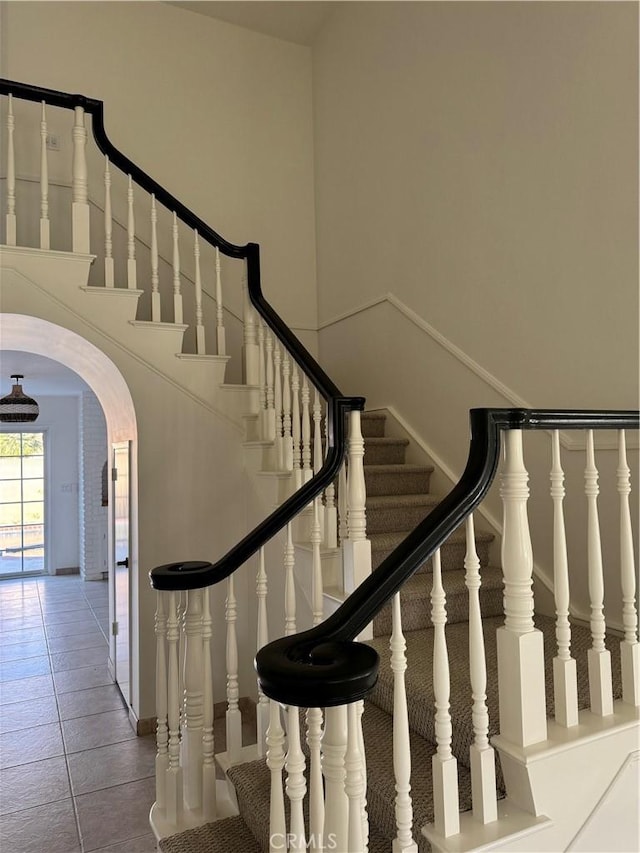 stairs with tile patterned flooring