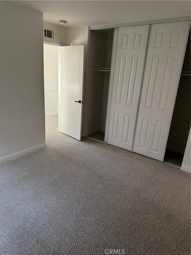 unfurnished bedroom with light carpet