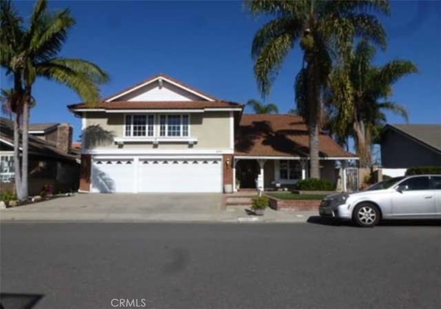 front facade with a garage