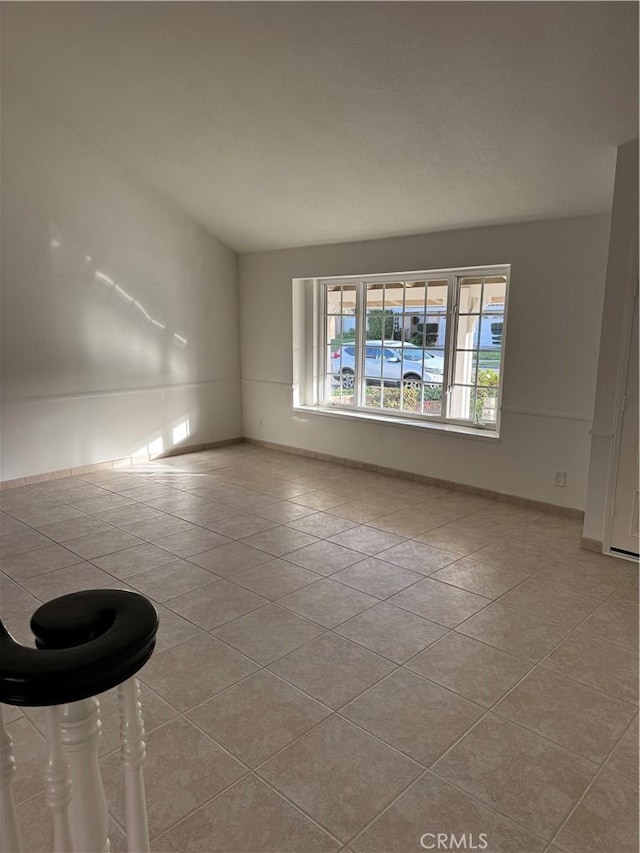 unfurnished room with light tile patterned floors