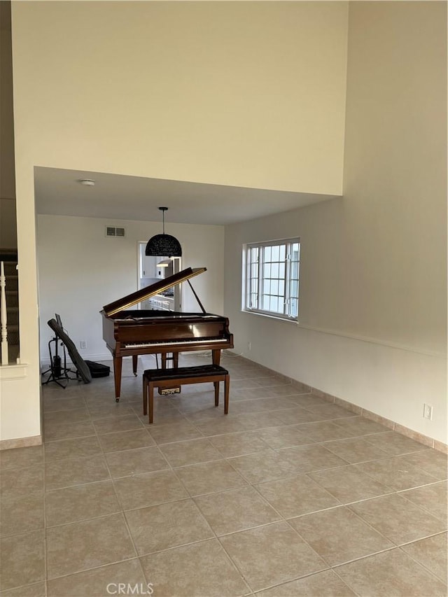 misc room with light tile patterned floors