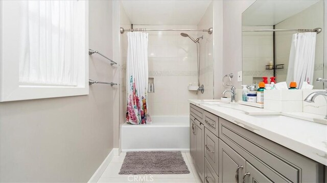 bathroom featuring vanity, tile patterned floors, and shower / bath combo