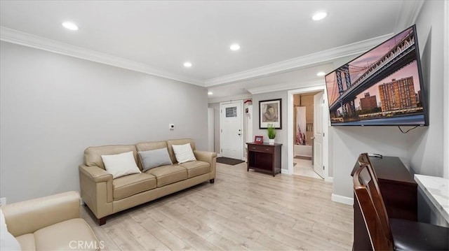 living room with crown molding and light hardwood / wood-style flooring