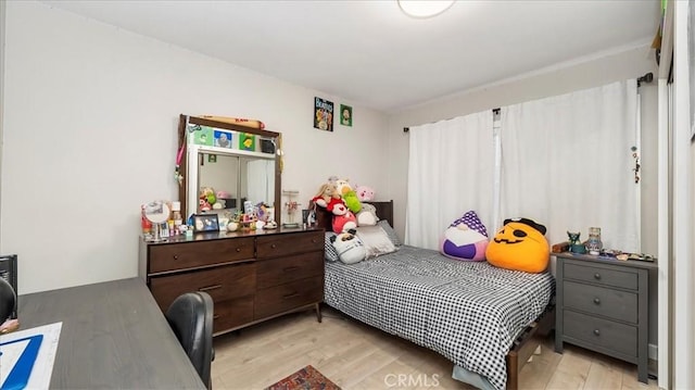 bedroom with light hardwood / wood-style floors