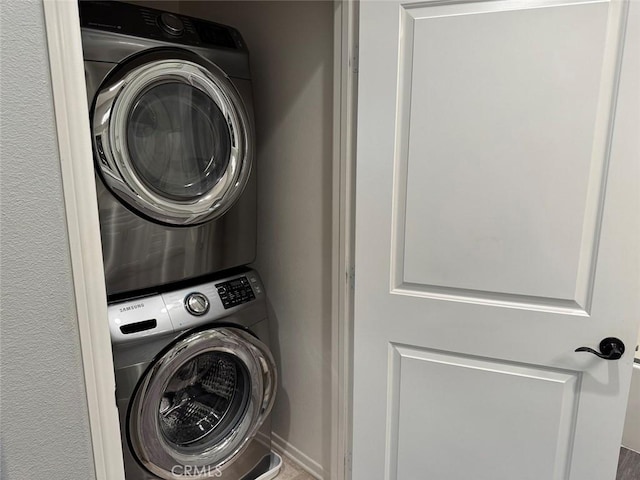 laundry room featuring stacked washing maching and dryer