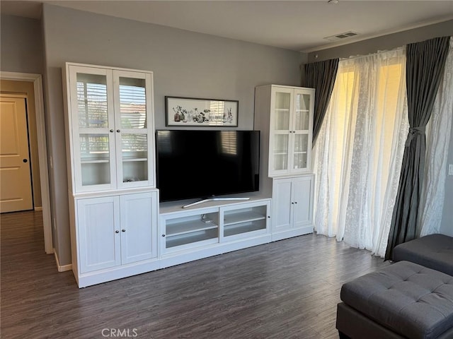 living room with dark hardwood / wood-style flooring