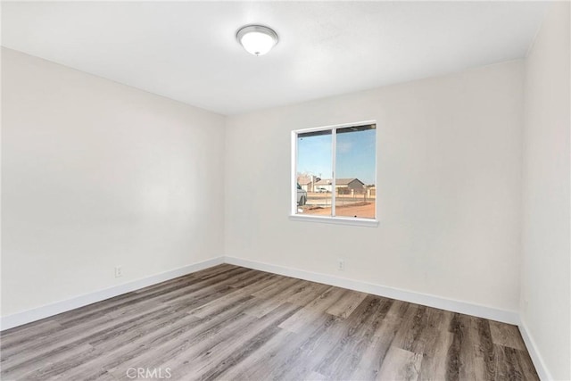 unfurnished room with light hardwood / wood-style flooring