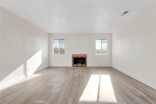 unfurnished living room featuring light wood-type flooring