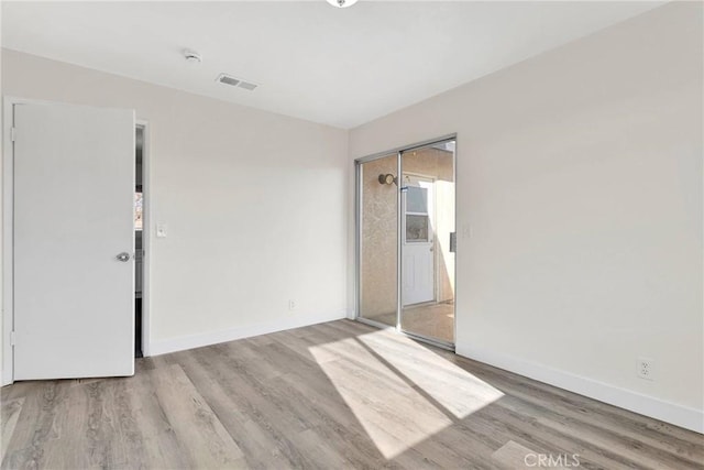 empty room with light wood-type flooring