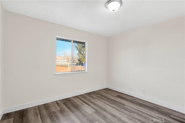 spare room featuring hardwood / wood-style floors