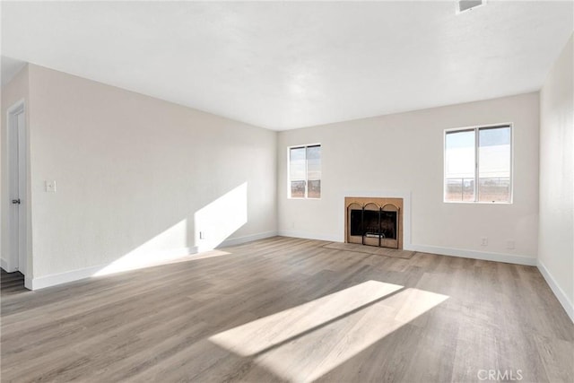 unfurnished living room with light hardwood / wood-style floors