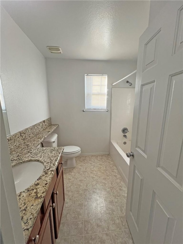 full bathroom featuring vanity, toilet, and  shower combination