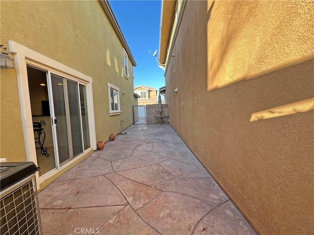 view of side of home featuring a patio