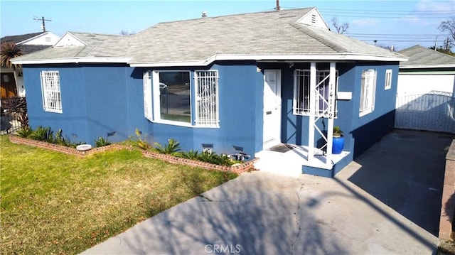 bungalow with a front lawn