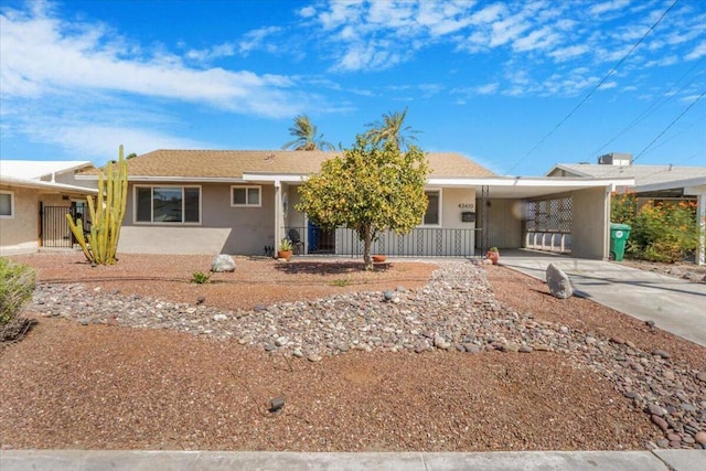 ranch-style house featuring a carport