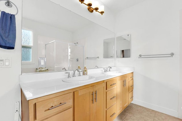 bathroom featuring tile patterned flooring, vanity, and walk in shower