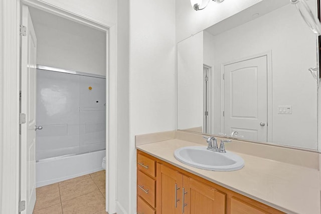 full bathroom featuring tile patterned floors, vanity, toilet, and bathing tub / shower combination