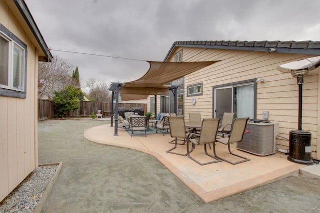 view of patio with central AC and a pergola