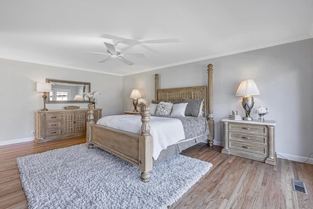 bedroom featuring crown molding, ceiling fan, and light hardwood / wood-style floors