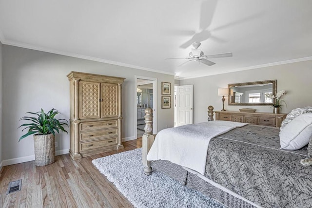 bedroom with crown molding, ceiling fan, ensuite bathroom, and light hardwood / wood-style flooring