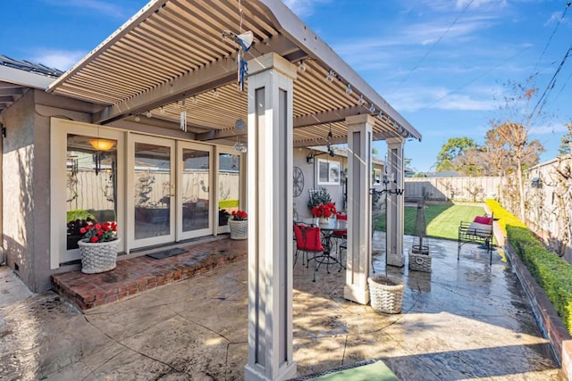 view of patio with french doors and a pergola