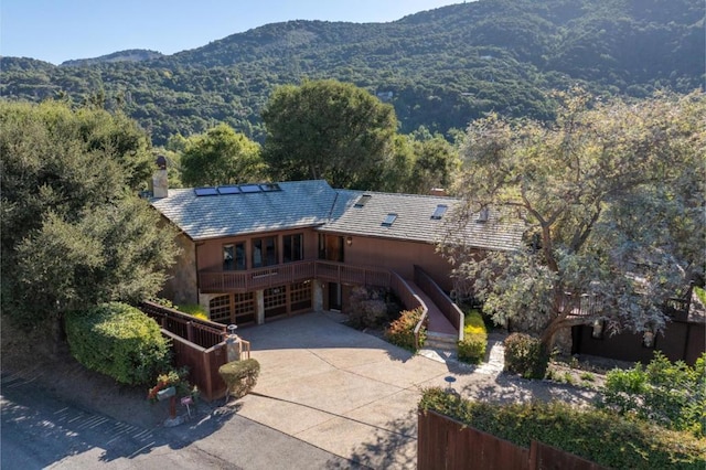 birds eye view of property with a mountain view