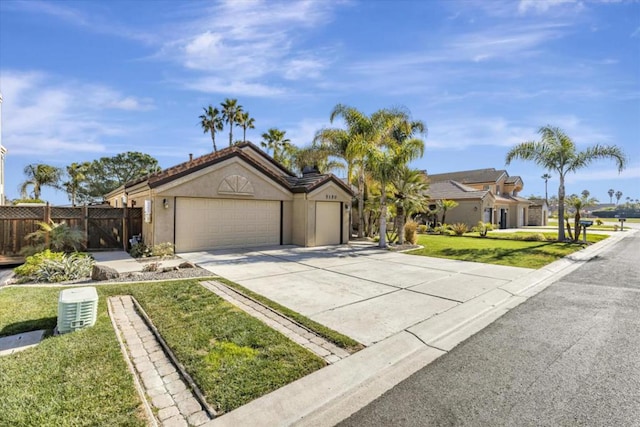 view of front of home featuring a garage and a front lawn