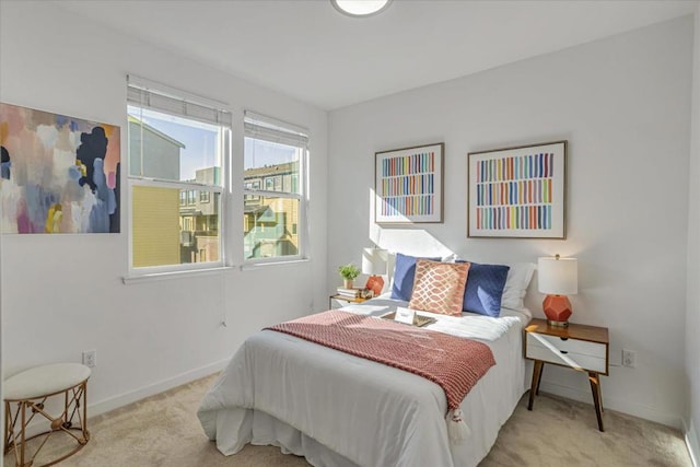 bedroom featuring light colored carpet