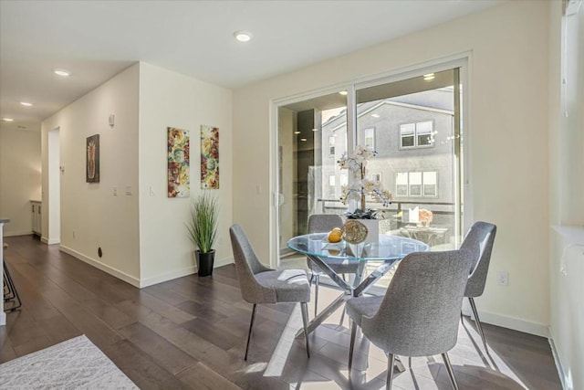 dining area featuring dark hardwood / wood-style floors