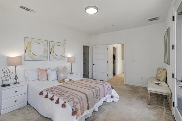 bedroom featuring light colored carpet