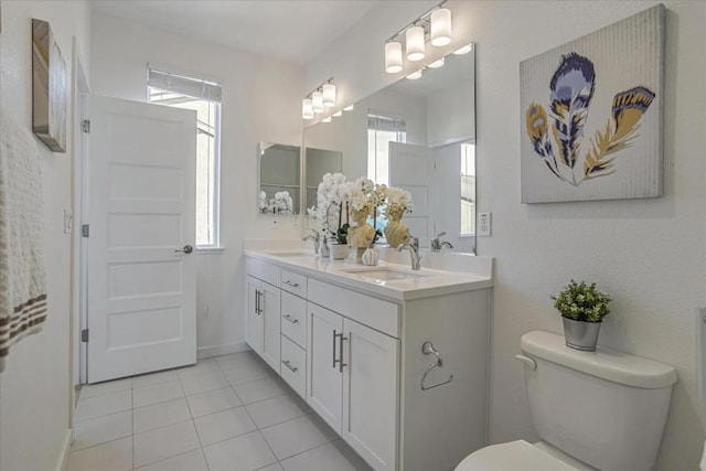 bathroom with tile patterned floors, vanity, and toilet