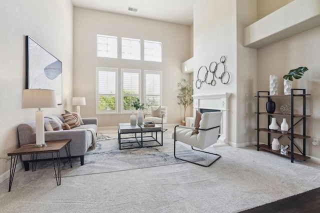 living area featuring a high ceiling