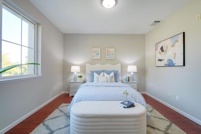 bedroom featuring dark hardwood / wood-style flooring