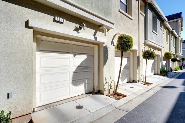 view of exterior entry featuring a garage