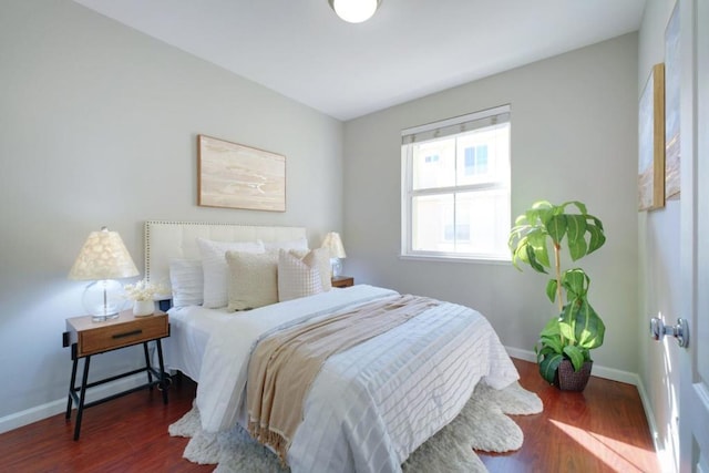 bedroom featuring dark wood-type flooring