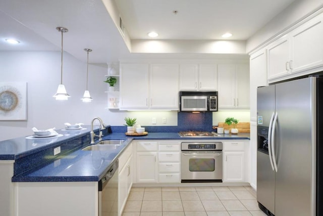 kitchen with white cabinetry, sink, and appliances with stainless steel finishes