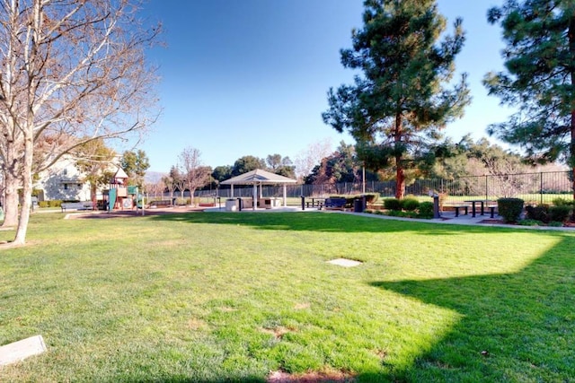 view of yard featuring a gazebo and a playground