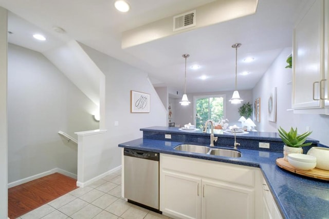 kitchen with white cabinetry, dishwasher, sink, and decorative light fixtures