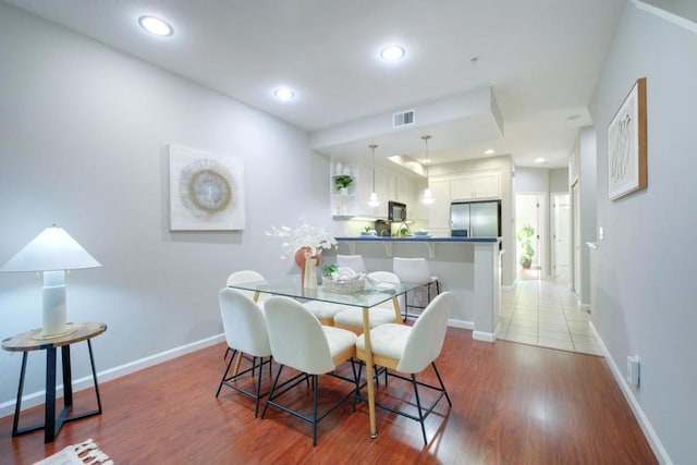 dining room with hardwood / wood-style floors