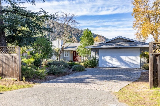 single story home with a garage