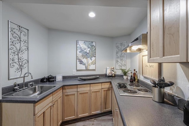 kitchen with stainless steel gas stovetop, sink, exhaust hood, and light brown cabinetry