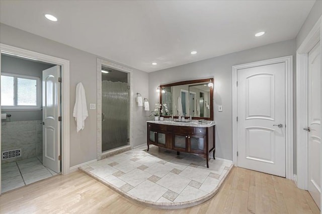 bathroom with vanity and hardwood / wood-style floors