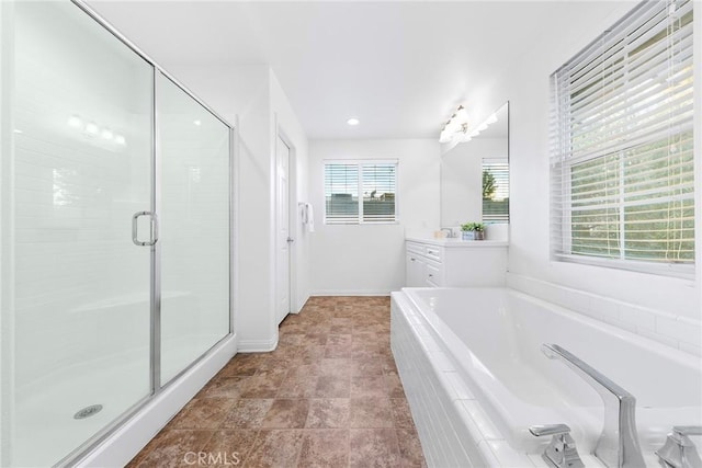 bathroom featuring vanity and separate shower and tub